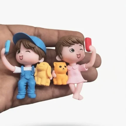 Product: Set of two miniature figurines of kids taking selfies with their pet animals, ideal for display.