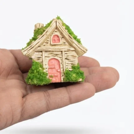 Charming thatched roof fairy tale cottage miniature house, a detailed and whimsical product for display.