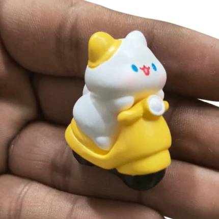 Delightful product: White bunny character riding a vibrant yellow scooter, perfect for miniature displays.