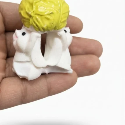 Detailed product image: Two white mice holding a green cabbage, ideal for miniature scenes or display.