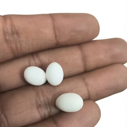 Charming miniature egg figurine product, ideal for dollhouse scenes and dioramas, with intricate detail.