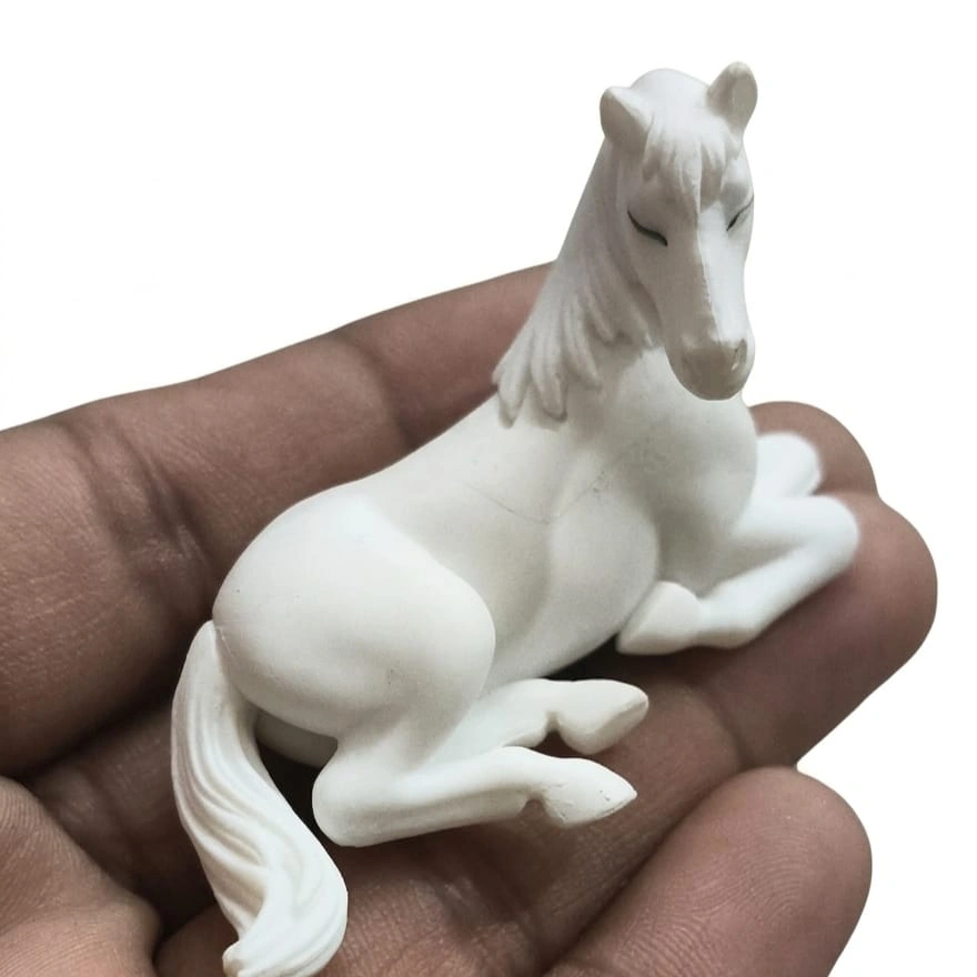 White-Resting-Horse-Miniature-Figurine Exquisite white resting horse miniature figurine, a charming product for any desk, shelf, or display.