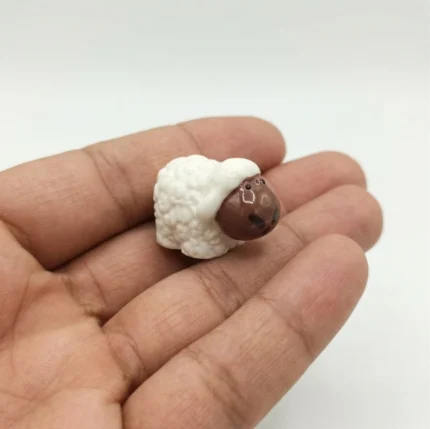 White sheep miniature animal figurine product, ideal for farm life scenes or display.