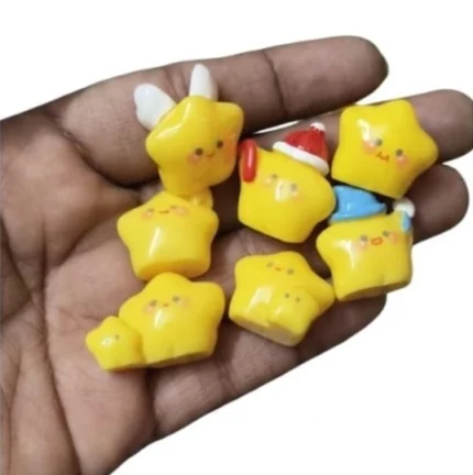 A cute yellow kawaii star flat-back miniature figurine product, perfect for dollhouse scenes or craft projects.