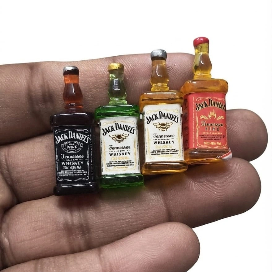 Jack-Daniels-Miniature-Whiskey-Bottle-Set-of-4-1 Detailed miniature Jack Daniel's whiskey bottle, randomly selected, showcasing intricate design of this product.