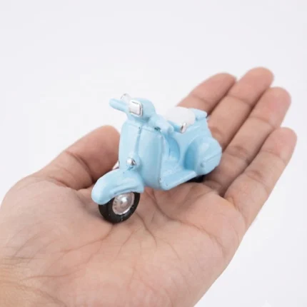 Charming light blue miniature scooter figurine product, perfect for any miniature collection or display.