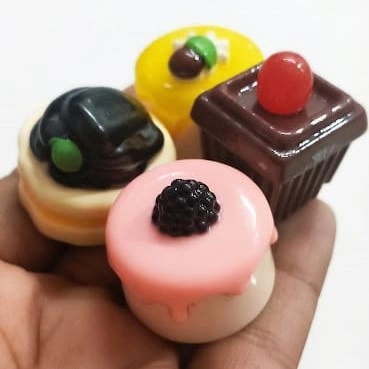 Assortment of random miniature desserts and tiny cakes, perfect for dollhouse or diorama product.