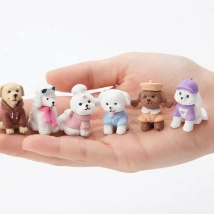 This delightful miniature dog figurine product features a randomly selected dog in a unique outfit.