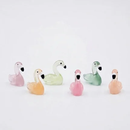 A delicate miniature glass swan and flamingo product, randomly selected, perfect for adding charm to any display.