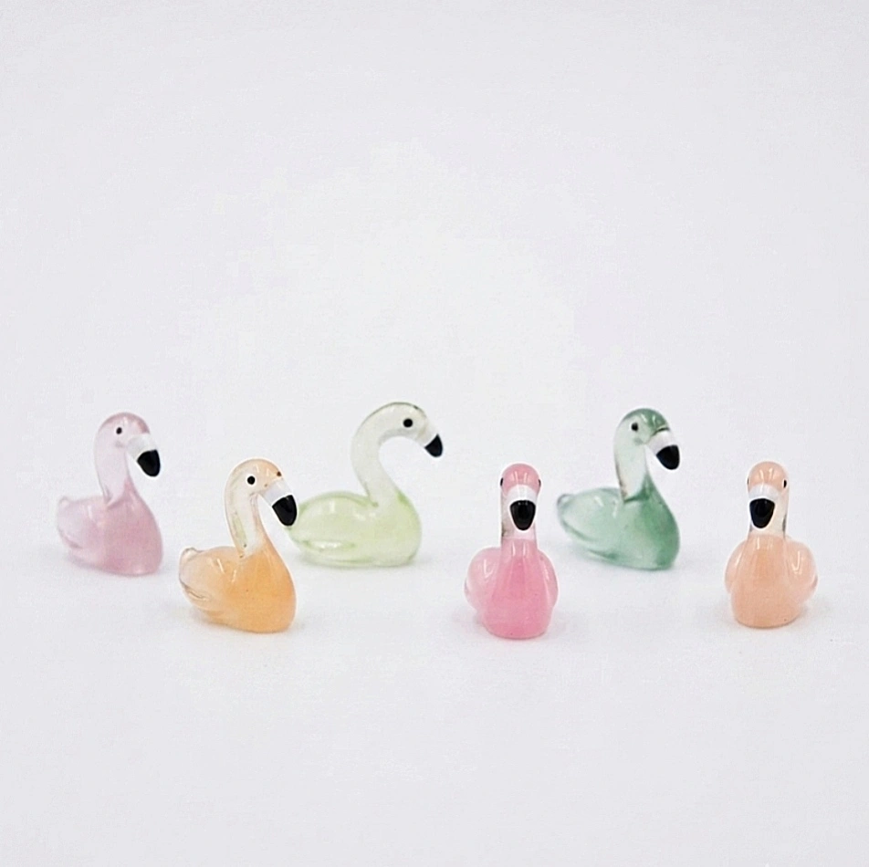 Miniature-Glass-Swan-and-Flamingo-Figurine-Set-of-6 A delicate miniature glass swan and flamingo product, randomly selected, perfect for adding charm to any display.