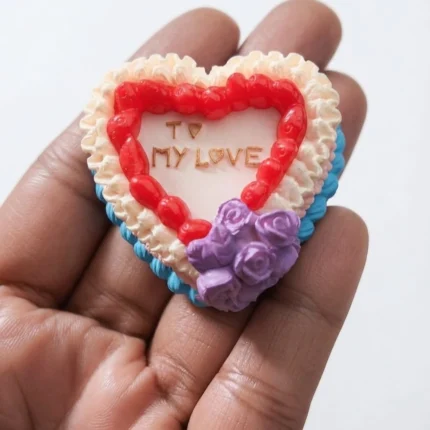 This exquisite miniature heart cake product features delicate purple roses decor, perfect for dollhouse displays.