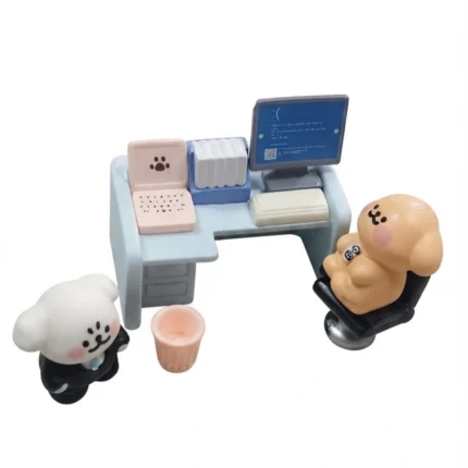 Detailed miniature office desk set product with desk, chair, and cute cartoon character figurines.