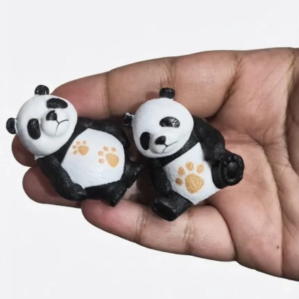 A charming miniature panda figurine product, each piece a unique random design, perfect for collectors and display.