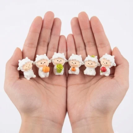 Charming miniature sheep figurine holding a basket of fruits, a unique decorative product.