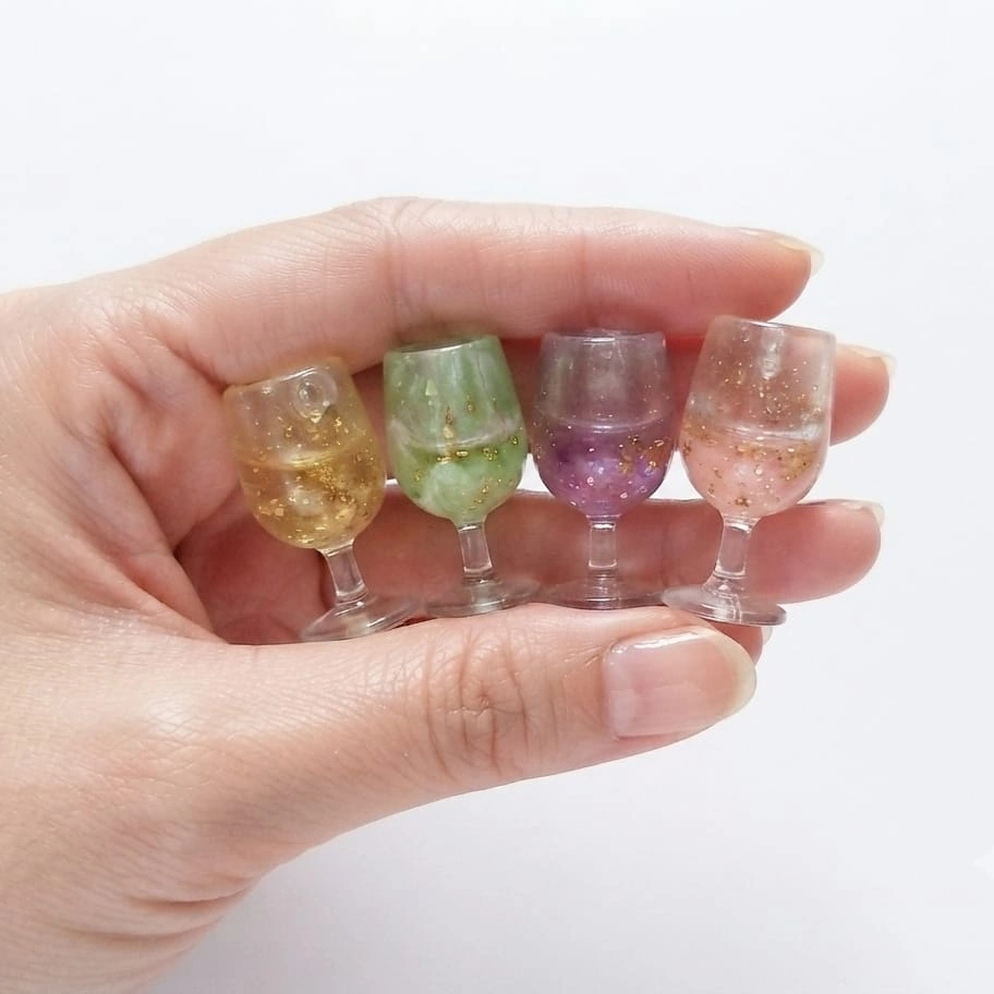 Miniature-Wine-Glasses-with-Glitter-Set-of-4 This product features charming miniature wine glasses with glitter, perfect for dollhouse scenes or tiny displays.