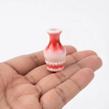 Beautiful red and white ceramic miniature vase product, ideal for dollhouse displays or tiny home decor.