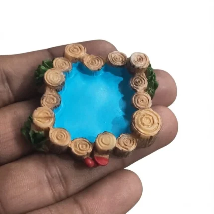 Charming resin miniature log pond with blue water and mushroom, ideal for miniature landscape product.