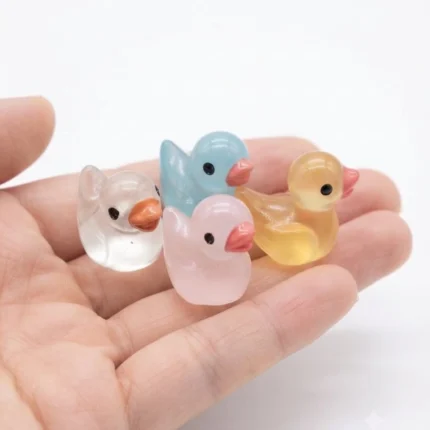 Translucent resin miniature duck figurine product, perfect for adding a whimsical touch to any tiny scene.