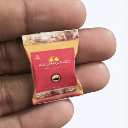 Realistic Aashirvaad Atta miniature flour packet product for dollhouse grocery scenes and tiny kitchen dioramas.