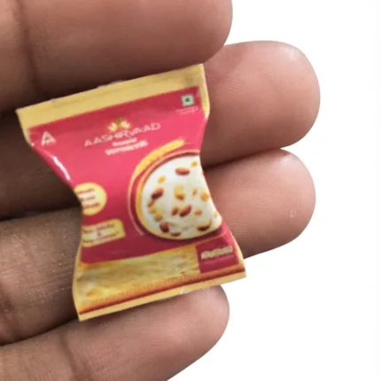 Highly detailed miniature product of Aashirvaad Roasted Vermicelli in a tiny packet, ideal for dollhouse kitchens.