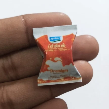 A realistic Aavin Premium miniature milk sachet product, perfect for dollhouse kitchens and diorama grocery scenes.