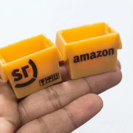 Miniature Amazon delivery box product, ideal for dollhouse or diorama scenes, adding realism.