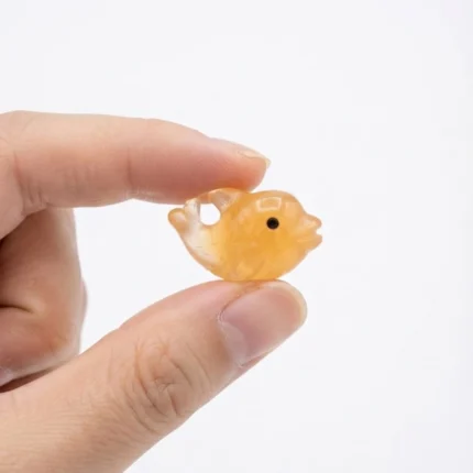 Detailed amber resin fish miniature figurine, an exquisite product for dollhouse or aquatic displays.