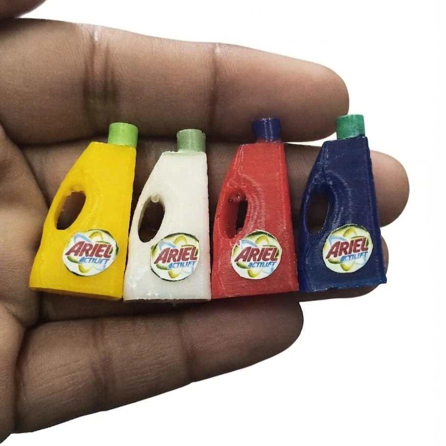 Ariel-Detergent-Miniature-Bottle-Set-of-4 Four highly detailed Ariel detergent miniature bottles, a decorative product for dollhouse scenes or collectors.