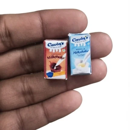 A detailed miniature Cavins milkshake tetra pack, a random selection of this tiny replica product for collectors.