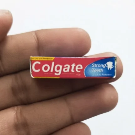 Highly detailed miniature Colgate Strong Teeth toothpaste box replica for dollhouse. This product adds realism.