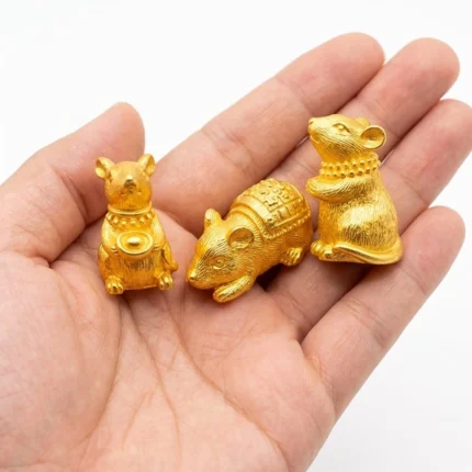 A set of three detailed gold miniature mouse figurine product, perfect for adding elegance to any display.