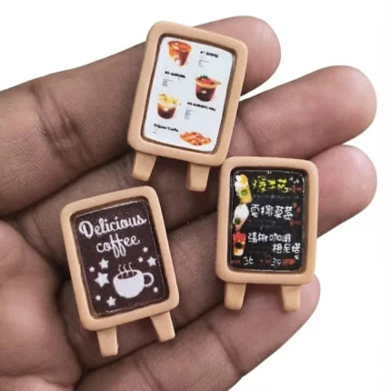 Miniature cafe menu board product with a random design, ideal for dollhouse cafe scenes or dioramas.