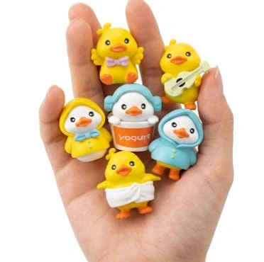A charming, randomly selected miniature cartoon duck figurine product for display or collection.