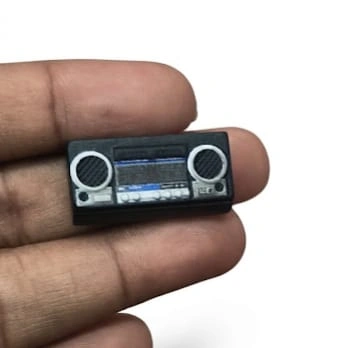 Detailed miniature cassette radio figurine product, perfect for retro decor, dollhouse, or unique collectible.