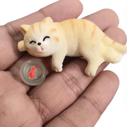 Detailed miniature cat figurine product with a tiny goldfish bowl, ideal for dollhouse collectors and displays.