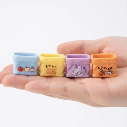 Vibrant miniature colorful cartoon storage basket, random design, charming product for tiny scenes.