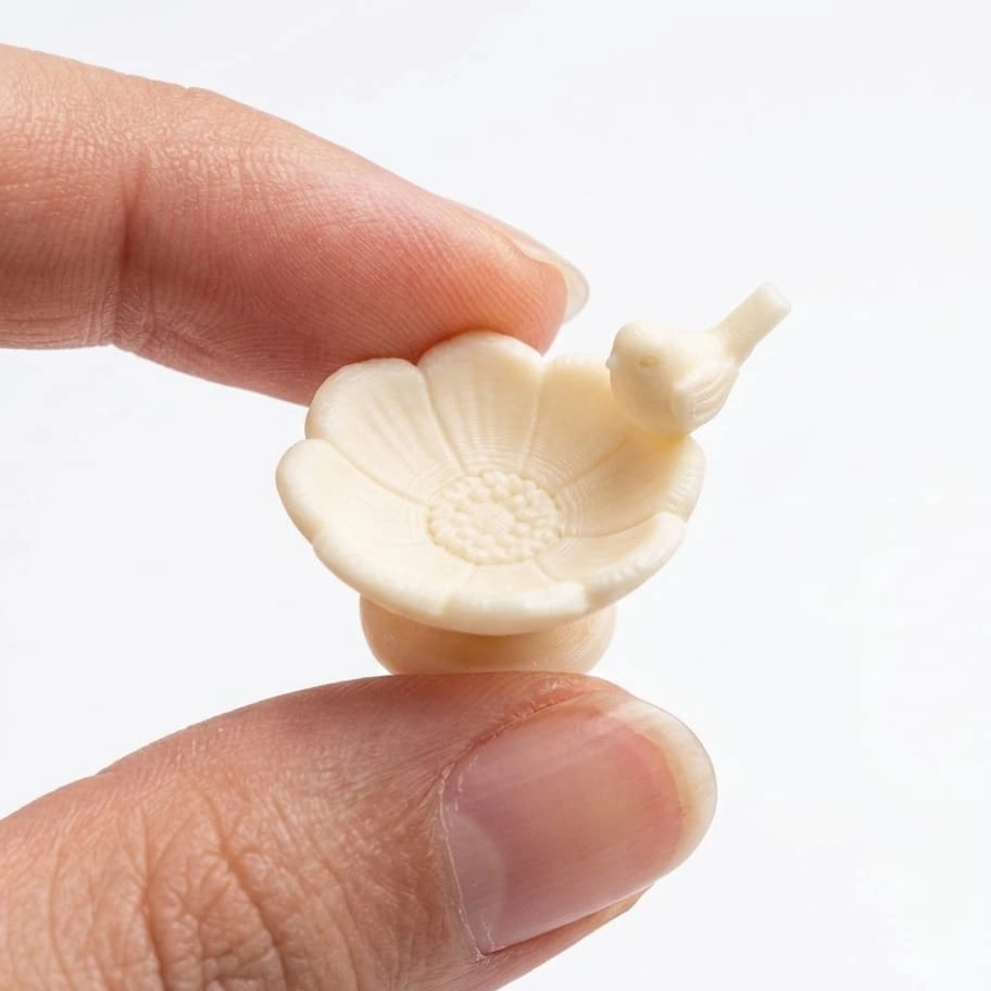 Miniature-Flower-Bird-Bath-with-Perched-Bird This miniature flower bird bath with a tiny perched bird is a charming product for dollhouse gardens.