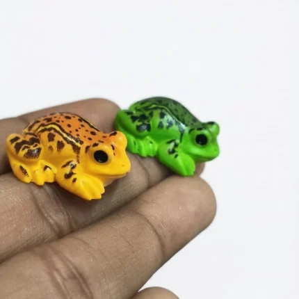 Charming, randomly selected miniature frog figurine product, perfect for whimsical collection.