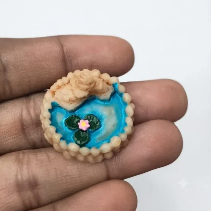 Miniature garden pond product with serene lotus flower scene, perfect for miniature landscape or dollhouse.