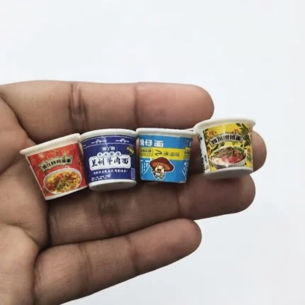 A random miniature instant noodle cup product, perfect for dollhouse kitchens or tiny food displays.