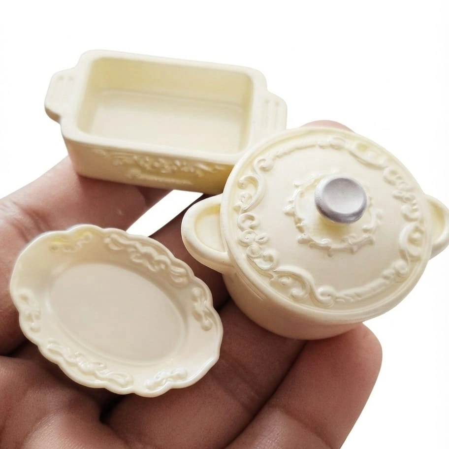 Miniature-Ivory-Cookware-and-Dinnerware-Set Detailed miniature ivory cookware and dinnerware set for dollhouse kitchen scenes, a high-quality product.