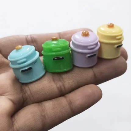 Charming miniature pastel cooking pot, randomly selected, for dollhouse kitchen scenes. A delightful product.