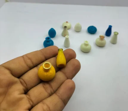 A randomly selected miniature vase, a tiny decorative product perfect for dollhouse displays or miniature scenes.