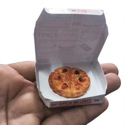 A highly detailed miniature pizza in an open box, a realistic dollhouse food product for collectors.