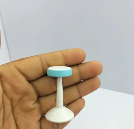 Detailed miniature round bar high stool figurine, an exquisite product for dollhouse scenes and dioramas.