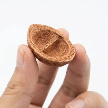 Beautifully crafted miniature round woven boat figurine, a decorative product for dollhouse scenes.