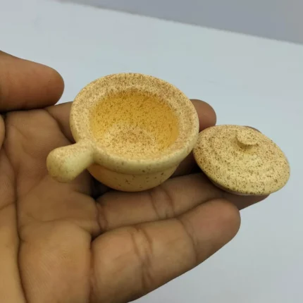 Miniature white ceramic casserole with lid, ideal for dollhouse kitchen scenes. A collectible product.
