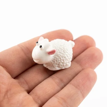 Charming miniature white fluffy sheep figurine product, perfect for whimsical display or collection.