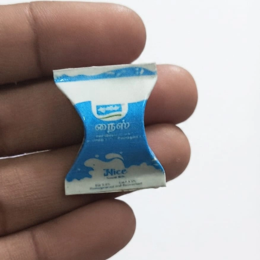 Nice-Miniature-Milk-Sachet Miniature milk sachet, highly detailed for dollhouse grocery scenes, adding realism to your product display.