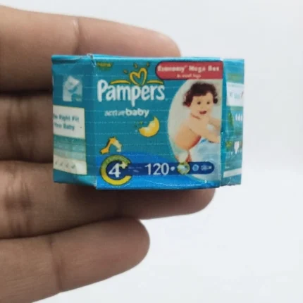 Highly detailed Pampers Active Baby miniature diaper box product for dollhouse nurseries and collectors.